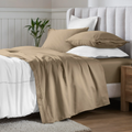 Taupe Egyptian Cotton Sateen Sheet Set styled on a modern bed with white accents