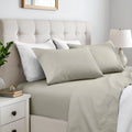 Taupe gray colored 600 thread count cotton blend bed sheet set on a neatly made bed