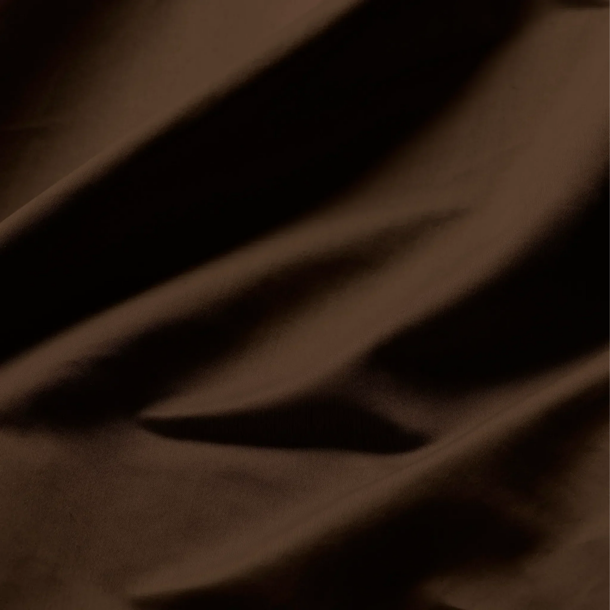 Texture detail of chocolate brown Egyptian Cotton Sateen 650 Thread Count sheets