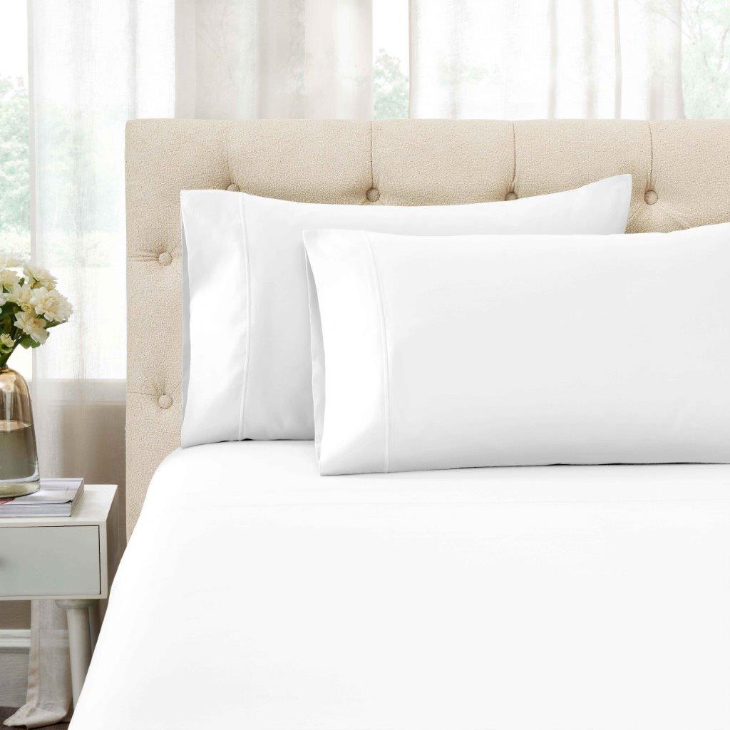 White 1500 Thread Count Egyptian Cotton pillowcases and matching sheet set detail close-up.