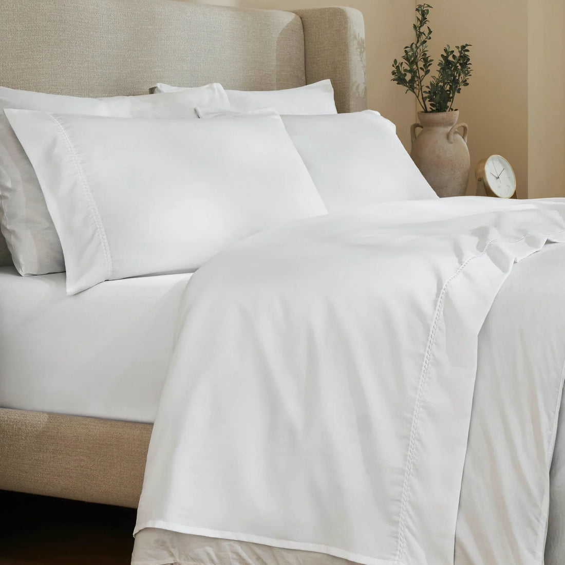 White 600 Thread Count Cotton Blend Bed Sheet Set with Imperia embroidered hem details on a luxury lifestyle bed display.