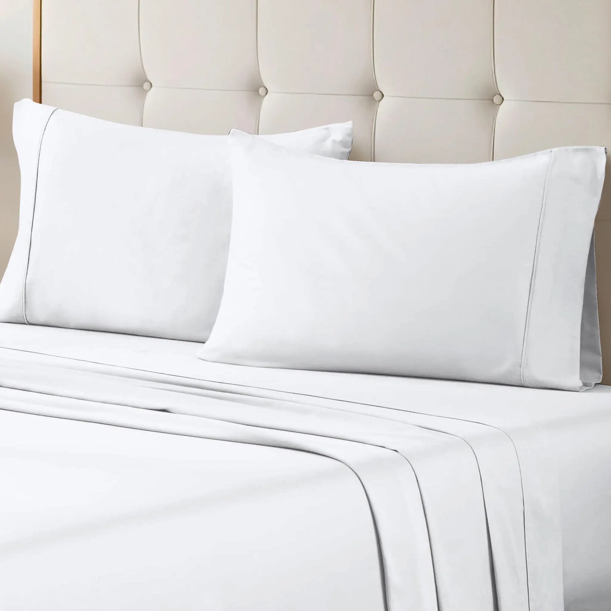 White 700 Thread Count Egyptian Cotton Sateen Bed Sheet Set displayed on a modern bed
