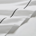 White/Black 600 Thread Count Cotton Blend Bed Sheet Set Imperia embroidery detail close-up texture.