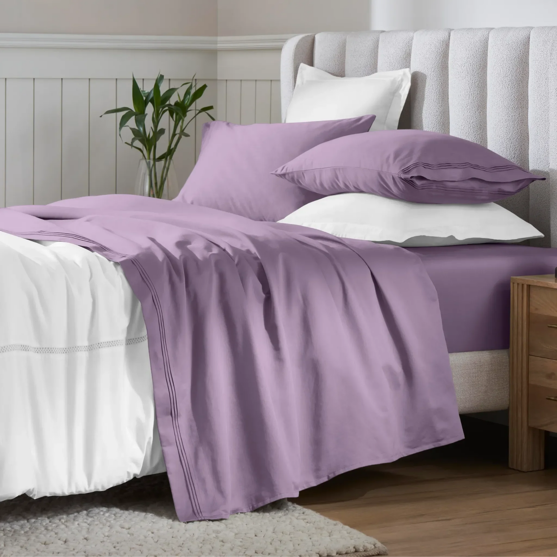 Wisteria Egyptian Cotton Sateen Sheet Set styled on a modern bed with white accents
