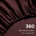 Close-up of an plum fitted sheet with 360-degree elastic for a secure fit around the mattress. 